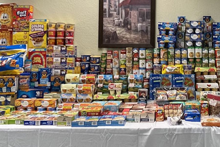 A table with donated food organized on top